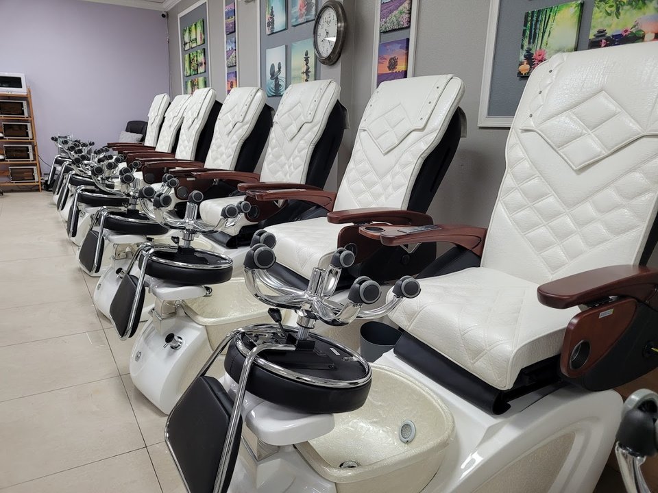 Clean nail salon interior with bright lighting.